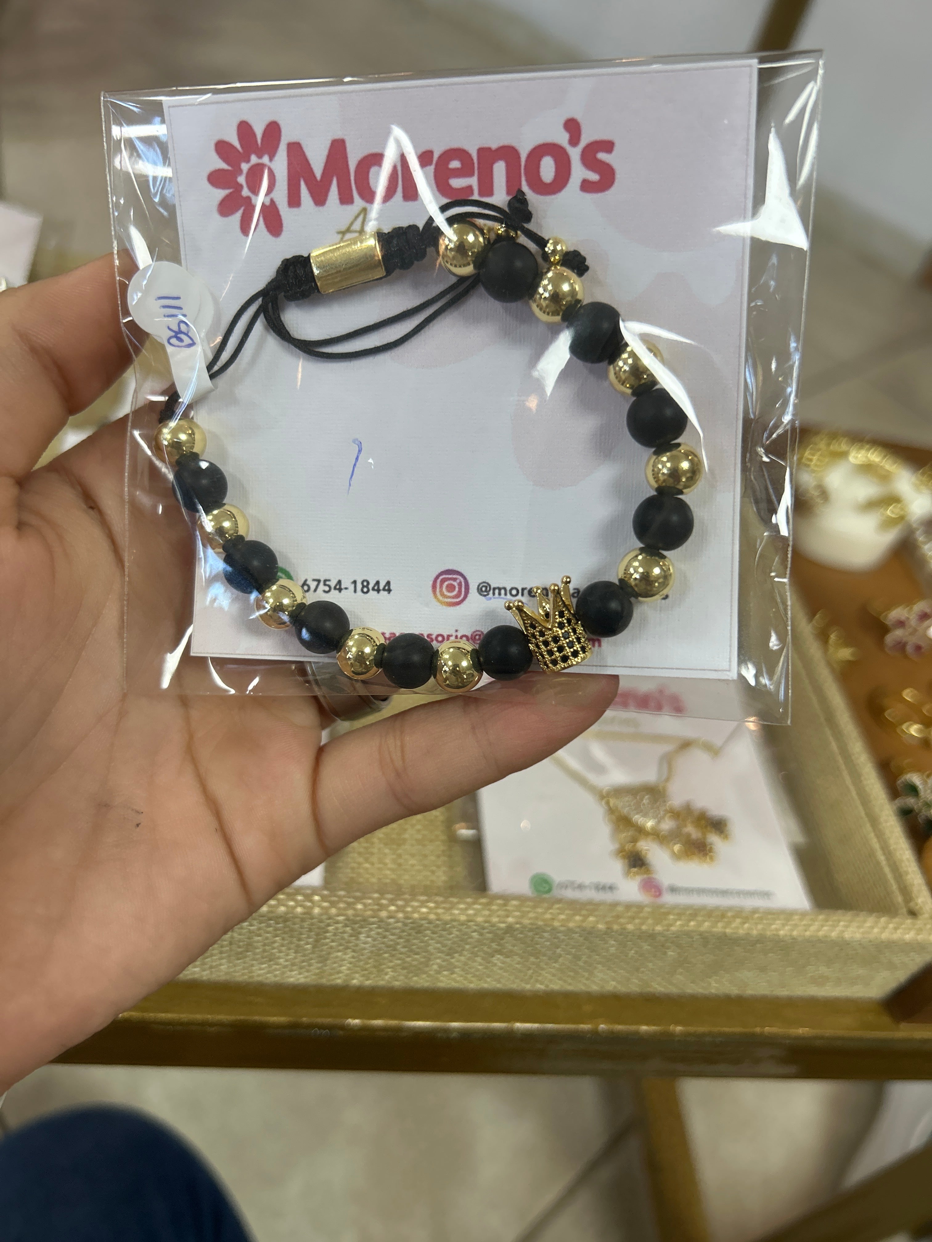 Pulsera negra con corona
